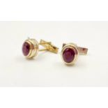 A pair of 14k yellow gold and ruby cufflinks, 4ct in rubies, weighs 10.2 grams