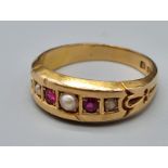 A VINTAGE 18K YELLOW GOLD RUBY AND PEARL RING. 4.1gms size M/N