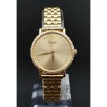 A PIAGET LADIES DRESS WATCH IN 18K GOLD WITH DIAMOND BEZEL AND SOLID GOLD STRAP, MANUAL MOVEMENT