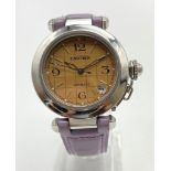 A CARTIER LADIES DRESS WATCH WITH CIRCULAR MUSTARD COLOURED FACE ANDCARTIER LILAC LEATER STRAP. 35mm