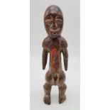 Antique 19th century African ivory carved fertility figurine from the Lega tribe in the Congo.