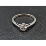 An 18K White Gold and Platinum Diamond Solitaire Ring. 2g. 0.35ct