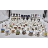 A collection of miniature ceramic bells from various locations around the UK.