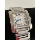 TANK style WRISTWATCH in stainless steel having black Roman numerals,blue hands,date window and