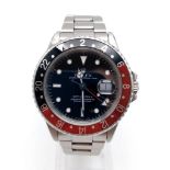 A ROLEX GMT-MASTER II WITH BLACK FACE AND RED AND BLACK BEZEL IN STAINLESS STEEL, 40mm