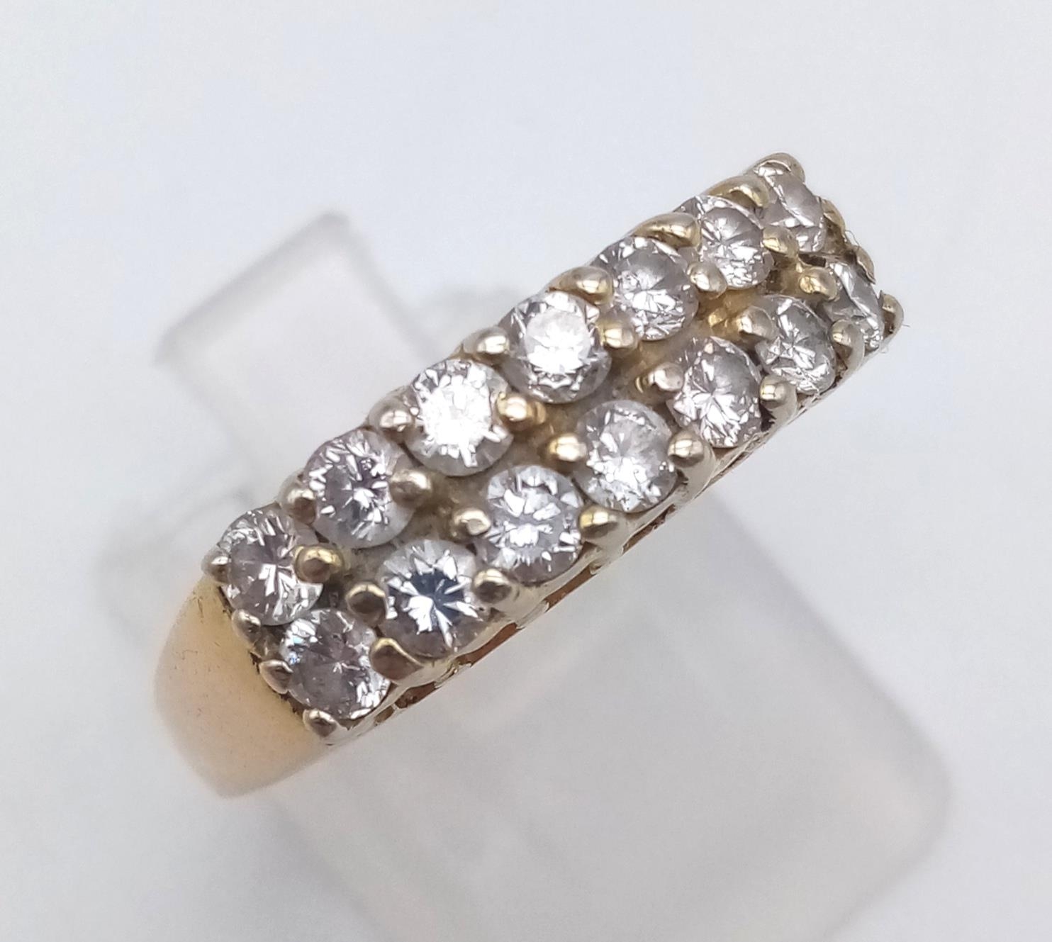 A 14 K yellow gold ring with two rows of diamonds (0.6 carats). Ring size: N, weight: 5.2 g.
