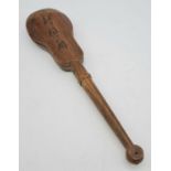 AN ANTIQUE CHINESE WOODEN RATTLE. 26cms IN LENGTH