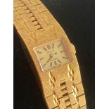 Ladies VINTAGE AVIA 1950/60?s wristwatch in gold tone having integral strap with diamond cut design.