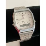 Vintage CASIO AQ228 WRISTWATCH in silver tone with stainless steel strap. Full working order. af.