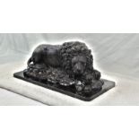 A Vintage, Possibly Antique Bronze Sculpture of a Resting Lion. Black patinated finish. Black marble