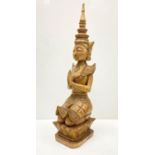 Tall wood carving art of Thai Buddha figure, kneeling in prayer. 57cm in height.