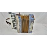 A Beautiful Vintage Italian Blue and Silver Frontalini Accordion. 40 x 40cm. Comes in original case.