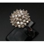 A 9K White Gold and Diamond Cluster Ring. Size R. 0.5ct. 5.1g
