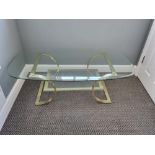 A Retro Glass and Gilded Metal Rectangular Coffee Table. 52 x 26 x16 (inches).