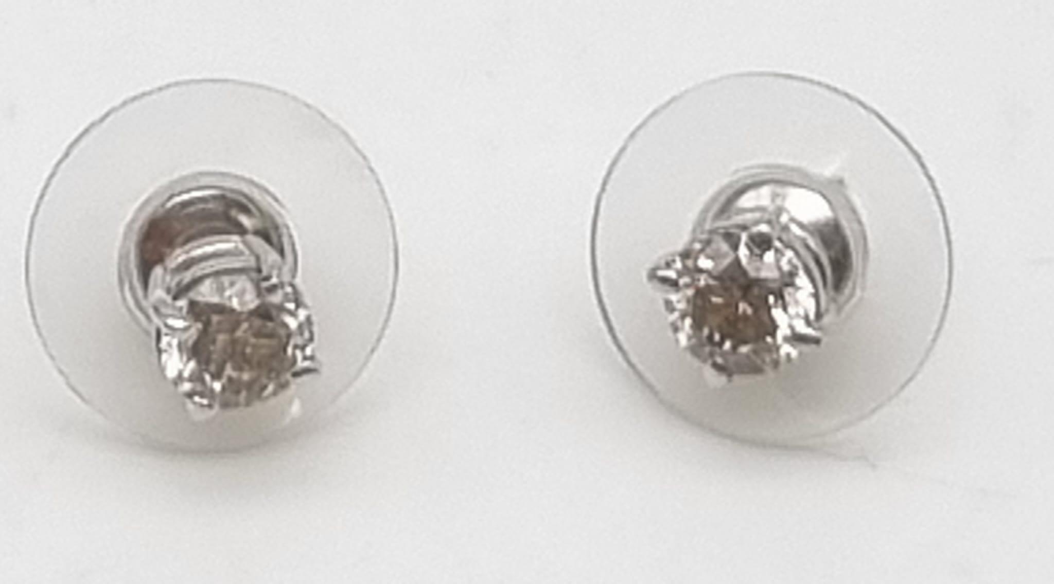 A Pair of 18K White Gold Diamond Stud Earrings. 1.0ct. N-I1 Grade. 1.27g total weight.