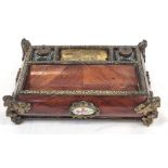 An Antique French Wood and Enamel Inkwell with Brass Ink Bottle holders and Ornate Brass Corners.