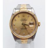A ROLEX OYSTER PERPETUAL DATEJUST IN BI-METAL WITH GOLDTONE FACE DIAMOND NUMERALS. 36mm