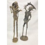 Two African bronze statues of a musician and a talisman. Height: 47 & 49 cm.