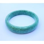 A Green Jade Bangle. 6.5cm inner diameter.