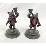 An Early Cold-Painted Bronze Pair of Fox Candlesticks - In the style of two celebratory Foxes.