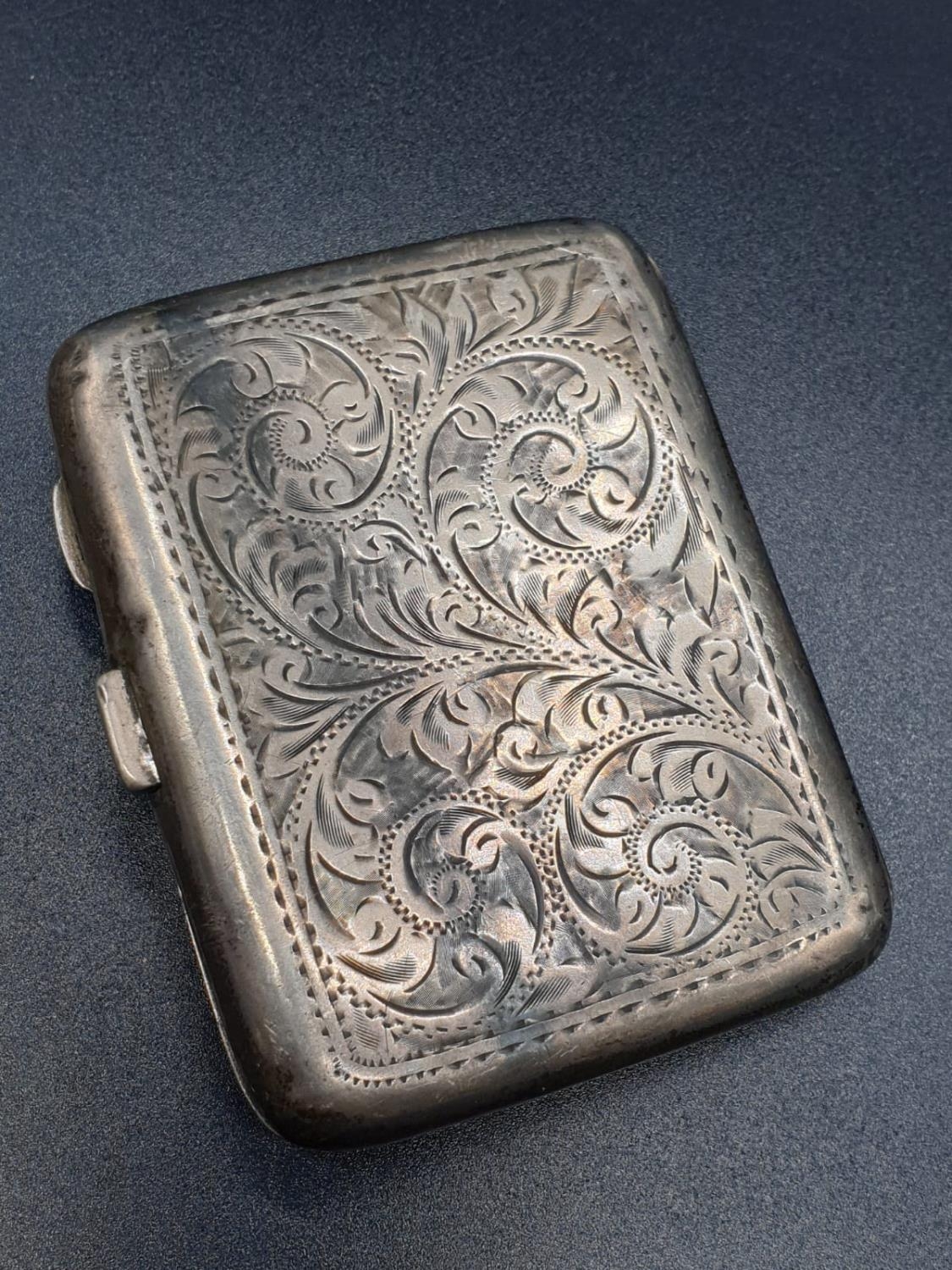 A Birmingham 1919 Hallmarked Silver Cigarette Case. Engraved decoration. A few signs of wear. A/F. - Image 5 of 7