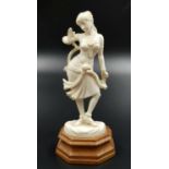 Antique Indian ivory figurine of a dancing lady, stands on original base. Height 14.4cm, weighs 85