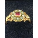 ANTIQUE VICTORIAN GOLD RING having Ruby and seed pearls set to top with oak leaf detail to