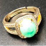 A Gold Plated Jade and White Stone Ring. Size R.