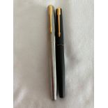 Two vintage PARKER FOUNTAIN PENS with gold plated nibs. 1 x Brushed steel with golden trim. 1 x