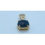 9k yellow gold pendant with approx. 3ct black opal and two diamonds, drop 28mm, total weight 2.8