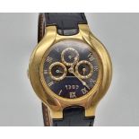 An Ebel Lichine 18k gold gents watch, black face, 18k adjustment rod, original black leather