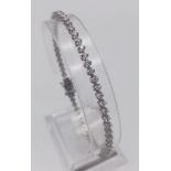 An 18K White Gold Diamond Tennis Bracelet. 2.3-2.5ct. I - VS Grade. 8.31g. 18cm.