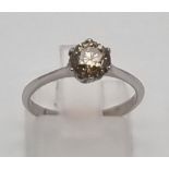 An 18K White Gold Yellow Diamond Solitaire Ring. Round cut yellow diamond - 0.88ct. I1 - Grade. Size