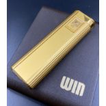 A Vintage Win Touch Gold Plated Lighter. As new, but needs battery and gas - so A/F. Comes in