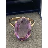 9 carat GOLD RING having large oval AMETHYST solitaire mounted to top. 4.11 grams. Size P - P 1/2.