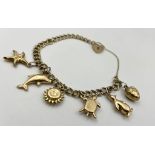 A 9K Yellow Gold Charm Bracelet with Six Charms. 16.6g total gold weight.