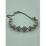 SILVER and DIAMOND BRACELET having 52 Diamonds set in graduated cluster style. 8? (20 cm).