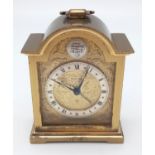 A Beautiful Brass Eight-Day Boudoir Swiza Alarm Clock. Swiss made. Gilded Dial decoration.
