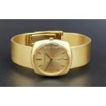 AN 18K GOLD PATEK PHILIPPE AUTOMATIC GENTS WATCH WITH SOLID GOLD STRAP AND GOLDTONE FACE 32mm