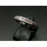 An 18K White Gold Diamond Half Eternity Ring. 0,40ct princess cuts. Size N. 5g