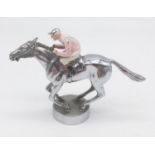 Vintage Lejeune chrome enamel car mascot in the form of a jockey at full gallop. Length 12.4cm,
