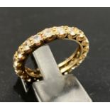 A 9K Yellow Gold White Stone Eternity Ring. Size L. 2.55g