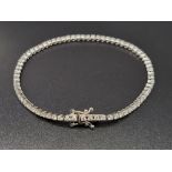 An 18K White Gold Diamond Tennis Bracelet. 3 - 3.2ct of diamonds. IJ -SI Grade. 8.43g. 18cm