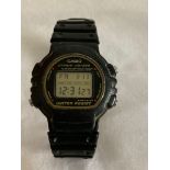 Vintage digital black CASIO WRISTWATCH having black rubber divers bracelet.Full working order. Light