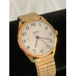 Vintage Sekonda wristwatch in gold tone having white face with black numerals and sweeping second