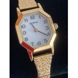 Ladies Quartz SEKONDA WRISTWATCH in gold tone having square octagonal case, white face,black