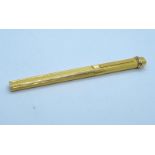 A French CARTIER pen. 18 K yellow gold plated. Length: 23.3 cm.