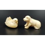 A pair of Japanese carved ivory figurines in the form of a dog and duckling bird. Length 4cm