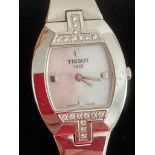 Ladies wristwatch in silver tone with diamante detail to bezel and white mother of pearl face.