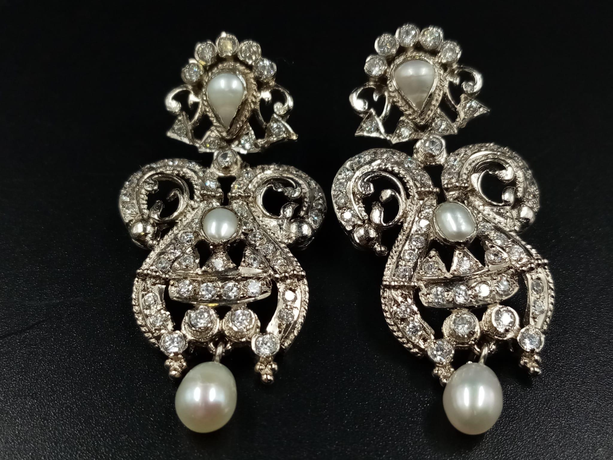 A Vintage pair of earrings with genuine pearls and cubic zirconia. Drop: 5 cm.